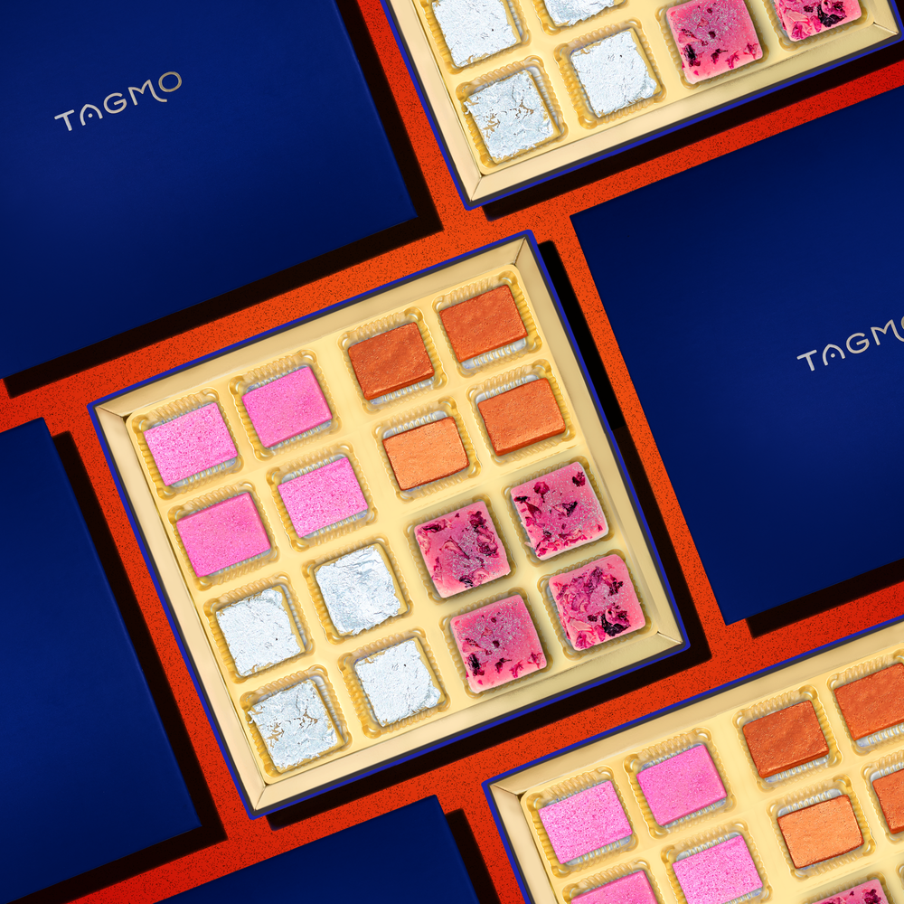 
                      
                        Assortment of traditional Indian sweets known as "Mithai" in a decorative box, with a variety of flavors including Kaju Katli, Badam Narangi, Kaju Burfi, and Rose Badam Burfi, presented in a 16 piece gift box
                      
                    