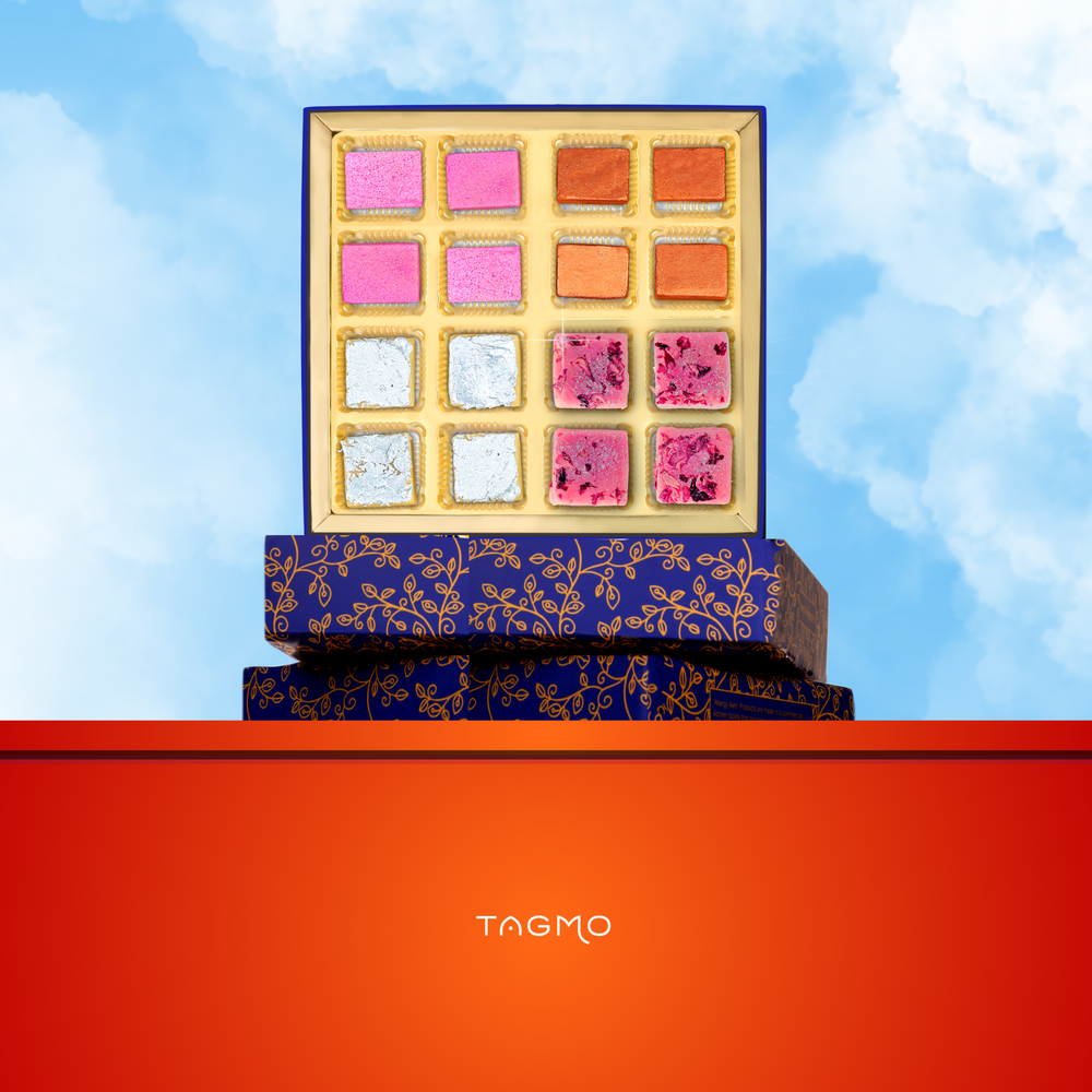 
                      
                        Assorted Indian mithai sweets in a Rakhi gift box, including kaju katli, badam narangi, kaju burfi, and rose badam burfi, showcasing the vibrant colors and textures of traditional Indian confectionery.
                      
                    